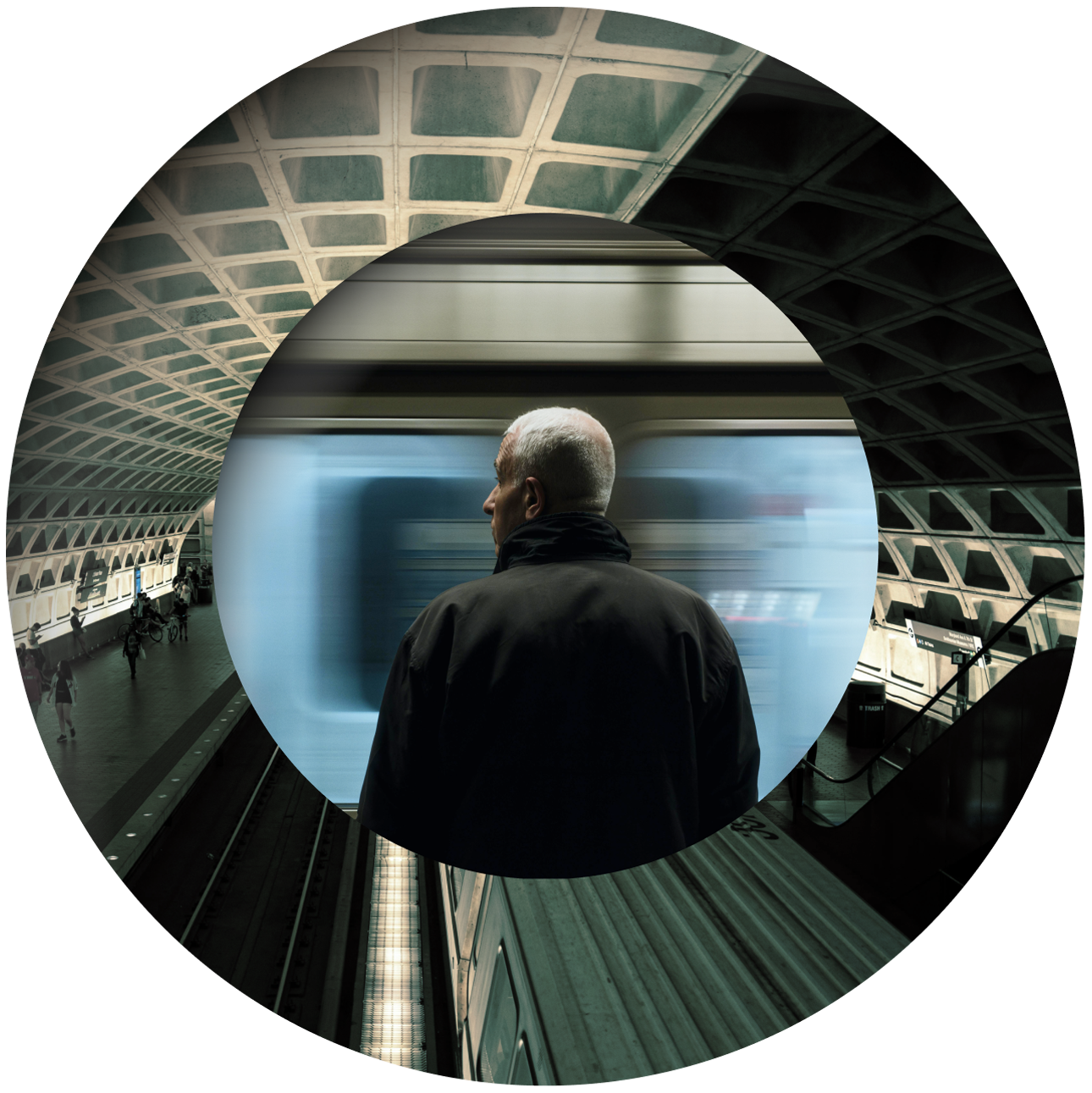 A gray-haired man stands on a subway platform facing a passing train, framed by overlapping circular shapes and a geometric ceiling.