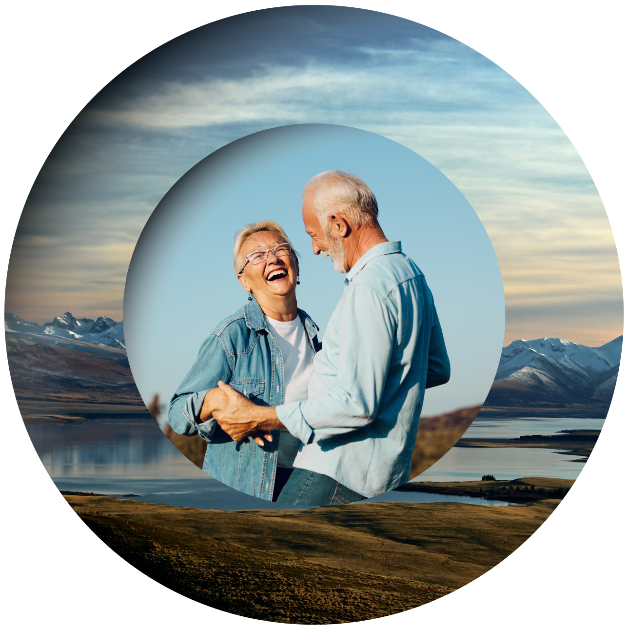 An elderly couple laughs and dances outdoors, framed by circular layers, with snow-capped mountains and a lake behind them.
